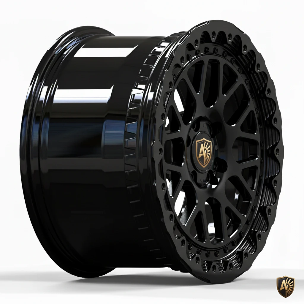 Black custom alloy wheel with intricate design and gold emblem on a white background.